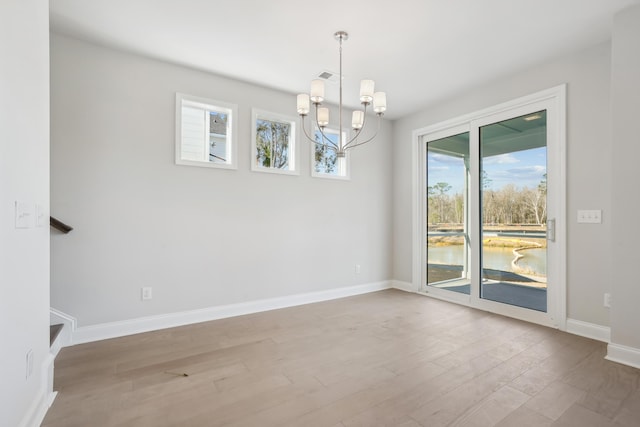 195 Claret Cup Way, Charleston, SC 29414 - unfurnished room with a chandelier and wood finished floors