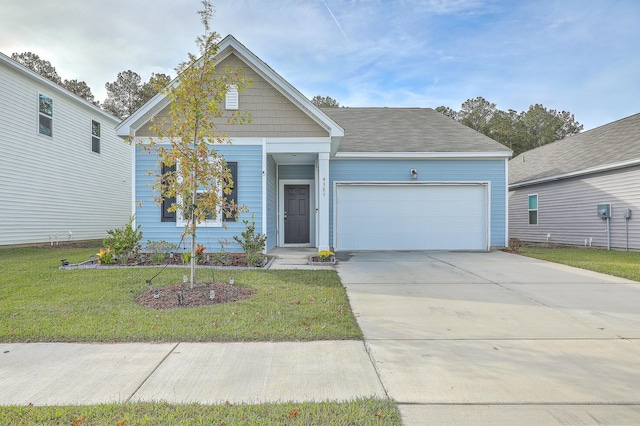 view of front facade featuring a front yard and a garage