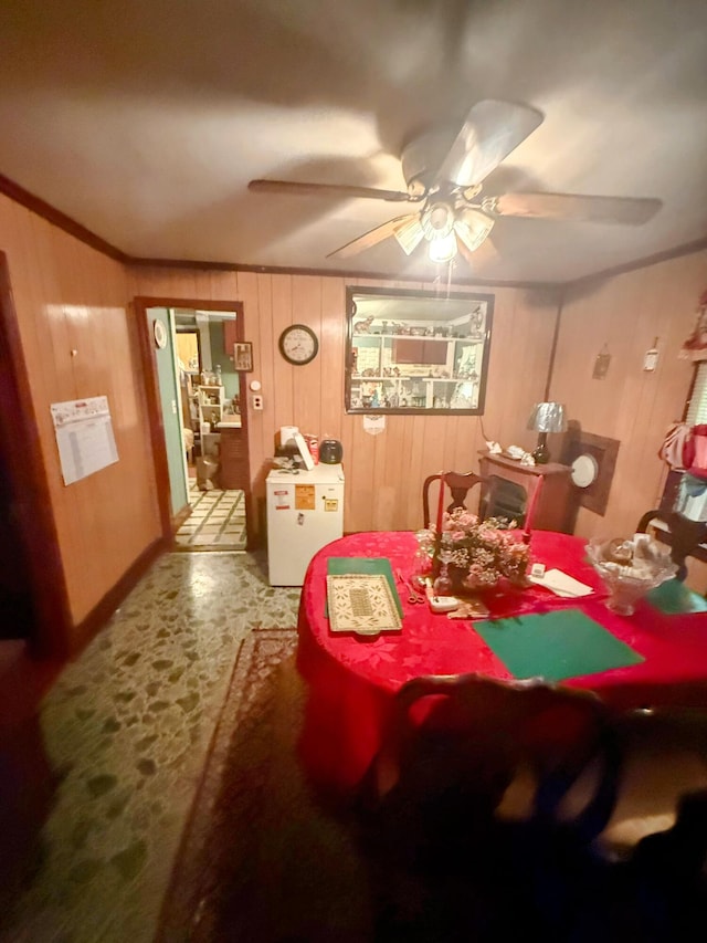 1124 Davidson Ave, Charleston, SC 29407 - dining space featuring ceiling fan, wooden walls, and ornamental molding