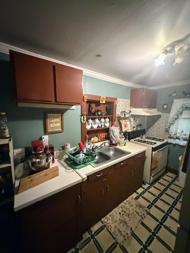 1124 Davidson Ave, Charleston, SC 29407 - kitchen with white range with gas stovetop, light countertops, ornamental molding, under cabinet range hood, and light flooring