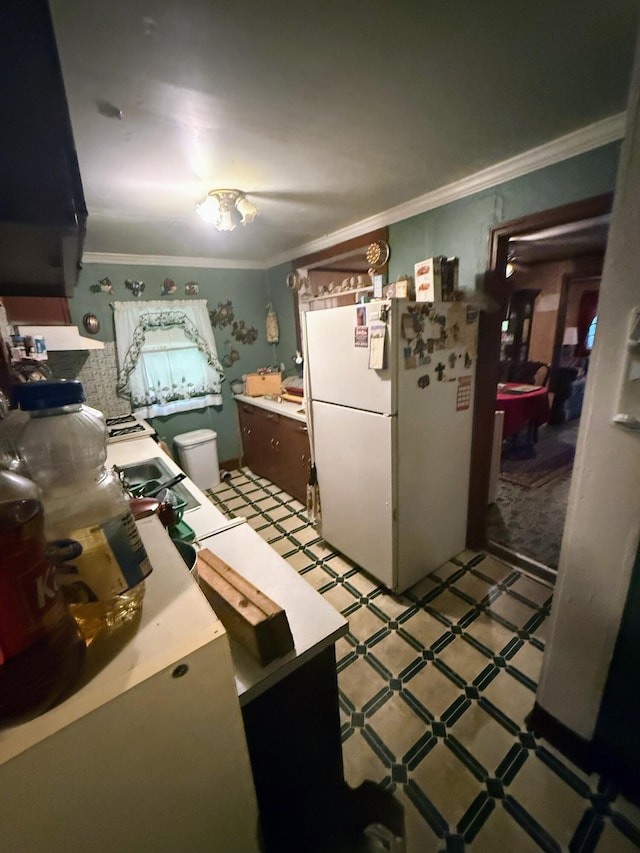 1124 Davidson Ave, Charleston, SC 29407 - kitchen featuring freestanding refrigerator, light floors, ornamental molding, and light countertops