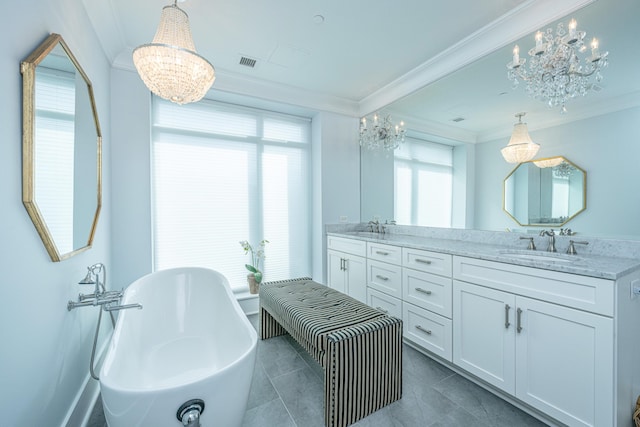 bathroom featuring ornamental molding, vanity, a tub, and a notable chandelier