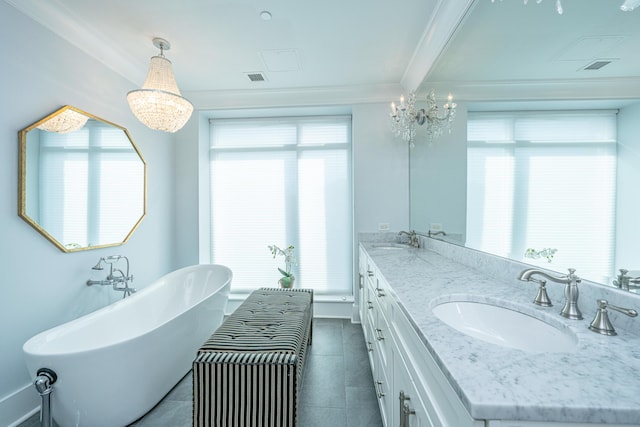 bathroom featuring a tub, vanity, a healthy amount of sunlight, and ornamental molding