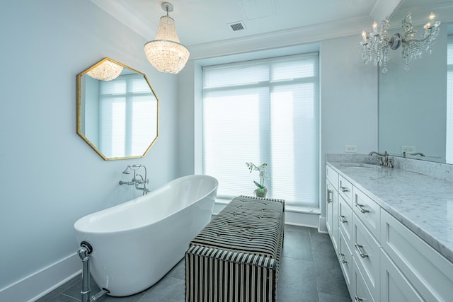 bathroom with a washtub, plenty of natural light, vanity, and an inviting chandelier