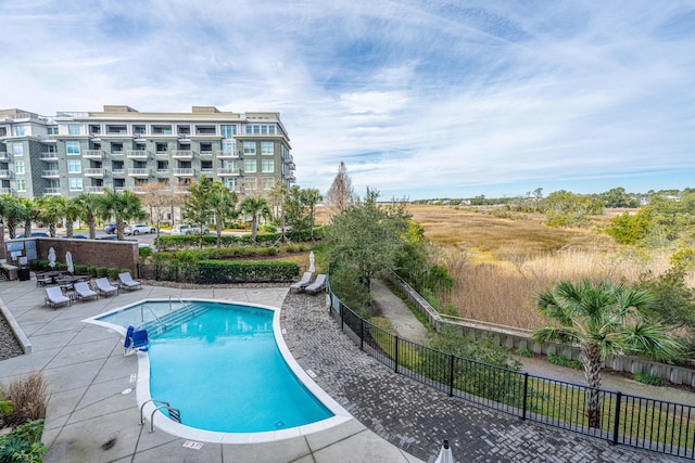 view of swimming pool with a patio area