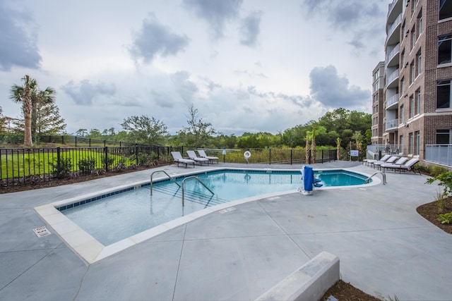 view of pool featuring a patio