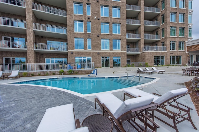 view of pool featuring a patio