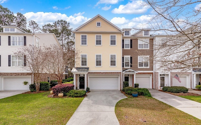 multi unit property with a garage and a front lawn