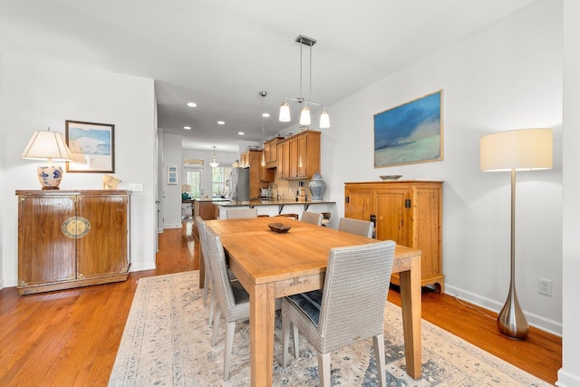 dining area with light wood-type flooring