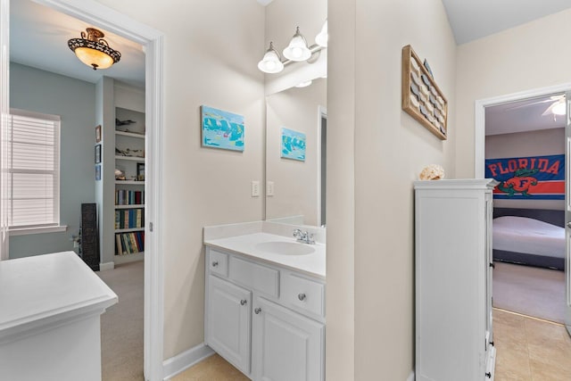 bathroom with ceiling fan and vanity