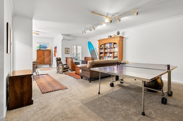 playroom featuring a wall mounted AC, carpet flooring, crown molding, and track lighting