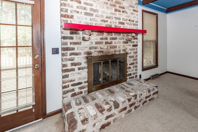 interior details with a fireplace and carpet flooring