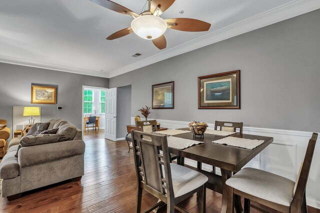 kitchen with wood-type flooring, light stone counters, stainless steel dishwasher, and decorative backsplash