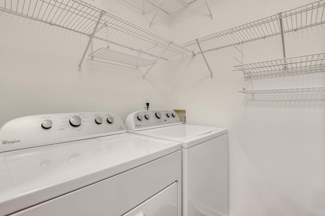 clothes washing area with independent washer and dryer