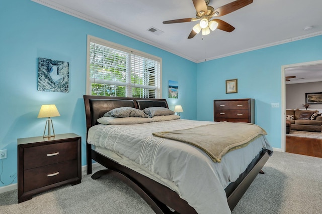 bedroom with light carpet, ornamental molding, and ceiling fan