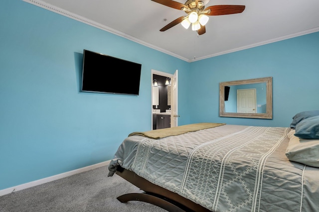 carpeted bedroom featuring ornamental molding, ensuite bath, and ceiling fan