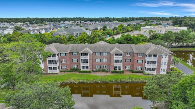 birds eye view of property with a residential view and a water view