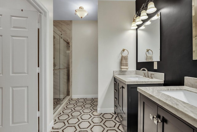 bathroom with vanity, an enclosed shower, and tile patterned flooring