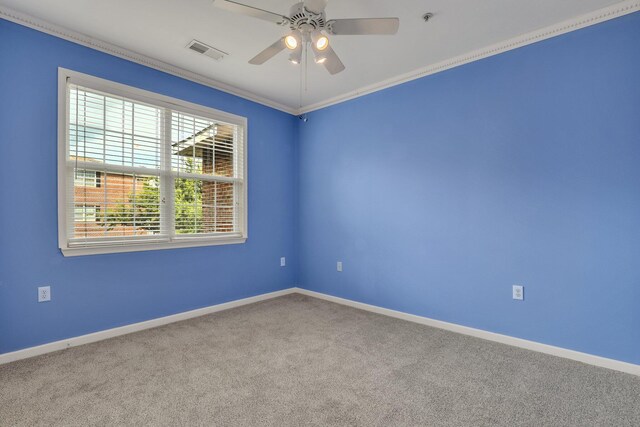 unfurnished room featuring ornamental molding, ceiling fan, and carpet floors