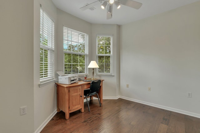 home office with a ceiling fan, baseboards, and dark wood-style flooring