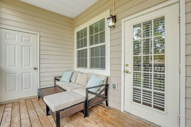 wooden terrace featuring covered porch