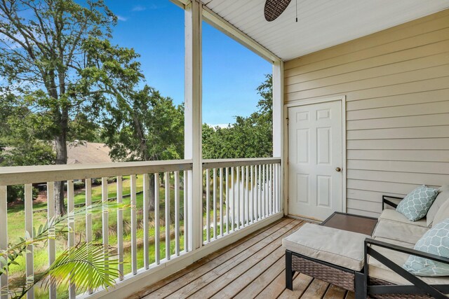 wooden deck featuring ceiling fan