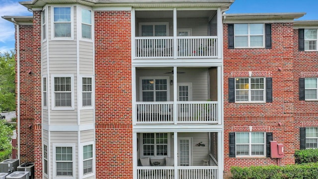 view of building exterior featuring central AC unit