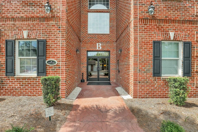 entrance to property with french doors and brick siding