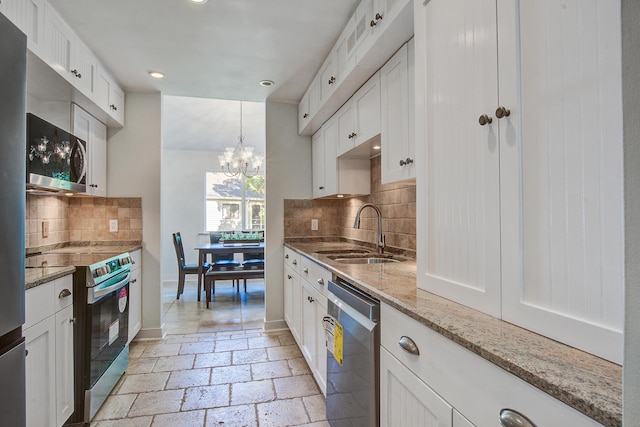 2334 Treescape Dr Unit 2006, Charleston, SC 29414 - kitchen featuring appliances with stainless steel finishes, a chandelier, recessed lighting, backsplash, and white cabinetry