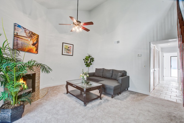 2334 Treescape Dr Unit 2006, Charleston, SC 29414 - carpeted living area featuring a towering ceiling, ceiling fan, and a premium fireplace