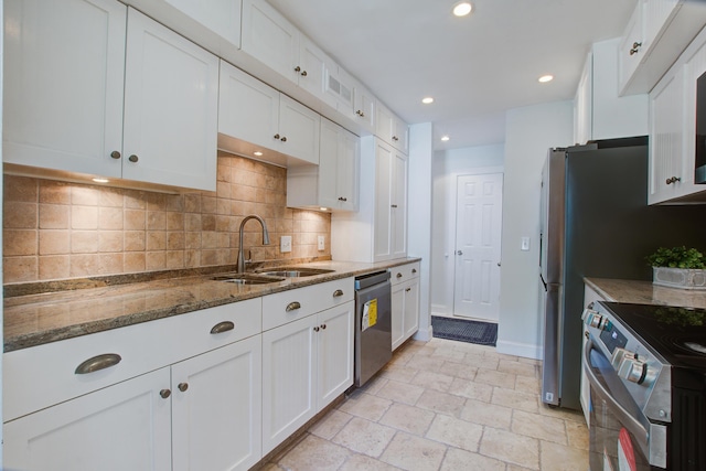 2334 Treescape Dr Unit 2006, Charleston, SC 29414 - kitchen with appliances with stainless steel finishes, stone counters, white cabinetry, tasteful backsplash, and stone tile flooring