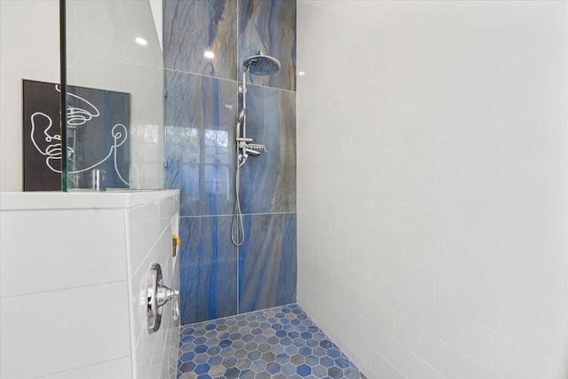 bathroom with tiled shower