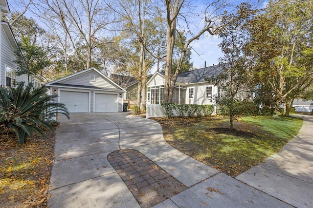 single story home with a garage and an outdoor structure