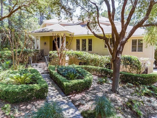 14 Royal Beach Dr, Kiawah Island, SC 29455 - view of front of home featuring stucco siding and roof with shingles