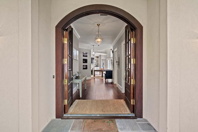 14 Royal Beach Dr, Kiawah Island, SC 29455 - corridor featuring ornamental molding, arched walkways, wood finished floors, and baseboards
