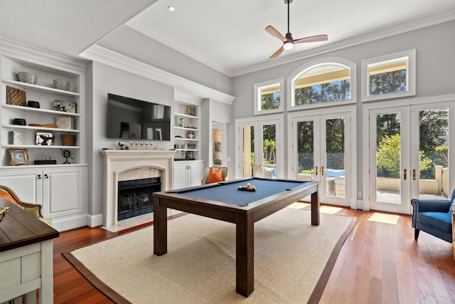 14 Royal Beach Dr, Kiawah Island, SC 29455 - game room with french doors, crown molding, a premium fireplace, a ceiling fan, and wood finished floors