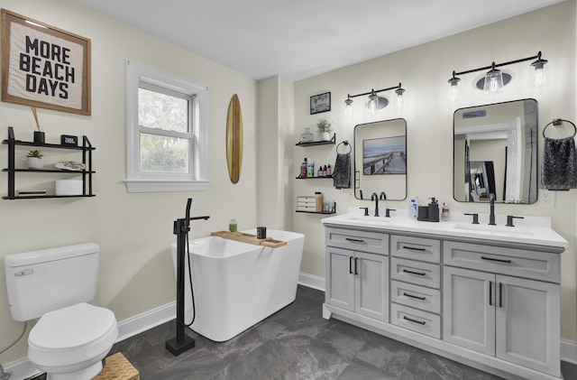 full bath with toilet, a soaking tub, double vanity, and a sink