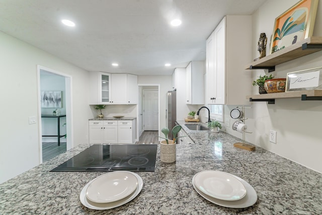 106 Kent Cir, Ladson, SC 29456 - kitchen with open shelves, light stone counters, black electric stovetop, a sink, and recessed lighting