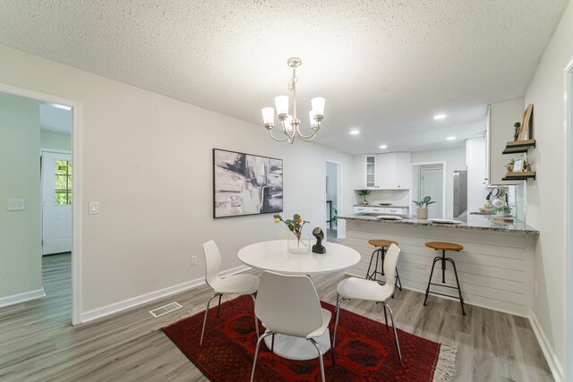 106 Kent Cir, Ladson, SC 29456 - dining room featuring recessed lighting, light wood finished floors, baseboards, and a notable chandelier