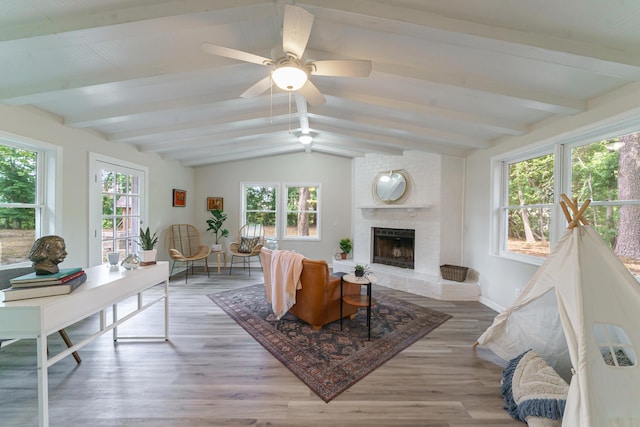 106 Kent Cir, Ladson, SC 29456 - living area featuring plenty of natural light, lofted ceiling with beams, light wood-style floors, and a brick fireplace