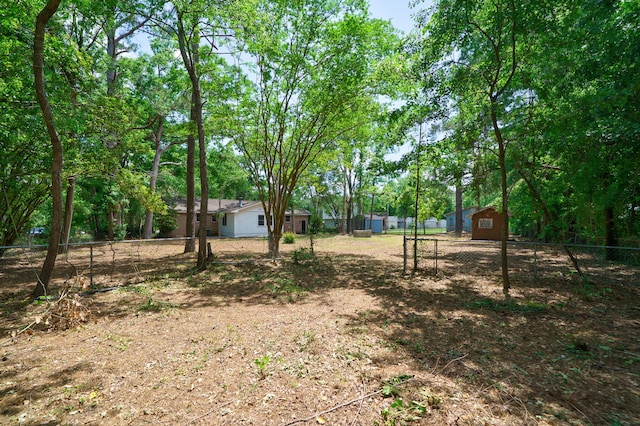 106 Kent Cir, Ladson, SC 29456 - view of yard featuring a storage shed, fence, and an outdoor structure