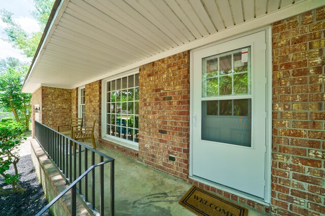 106 Kent Cir, Ladson, SC 29456 - property entrance featuring covered porch and brick siding