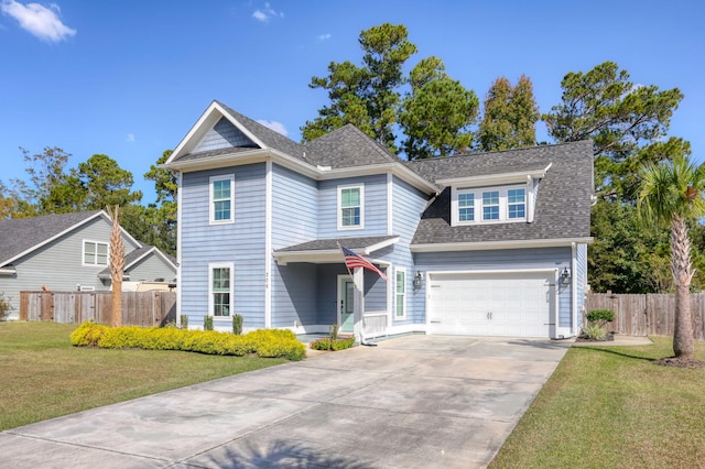 view of front of property featuring a garage and a front lawn