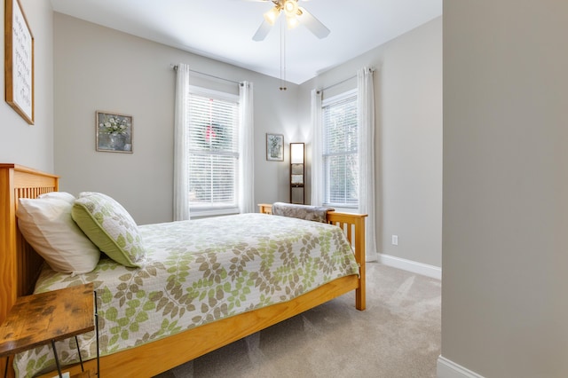 bedroom with ceiling fan and carpet flooring