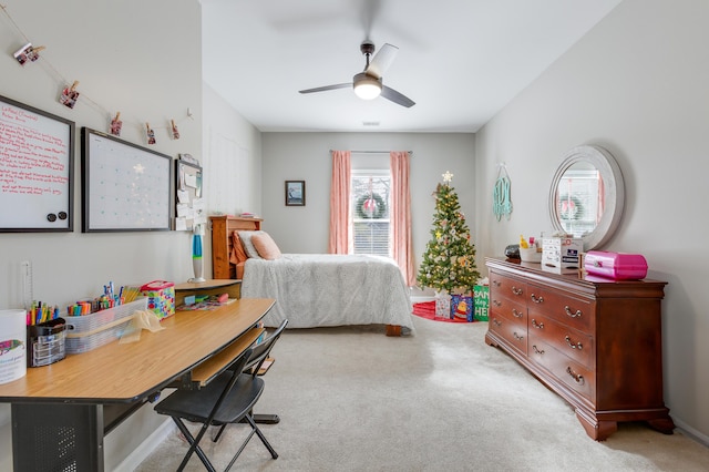 bedroom with ceiling fan and light carpet