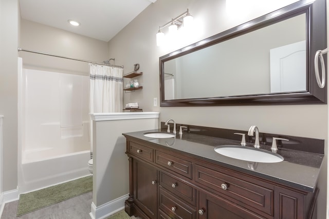 full bathroom featuring vanity, toilet, and shower / bath combo