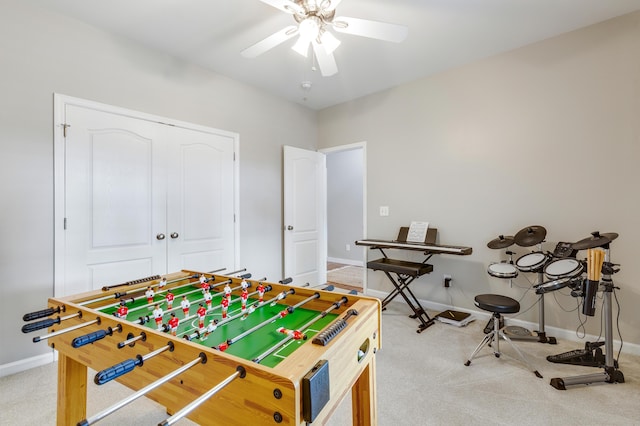 rec room with carpet flooring and ceiling fan