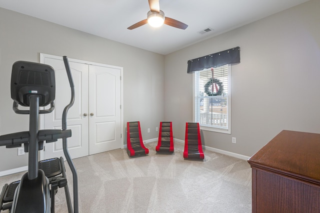 interior space with light colored carpet and ceiling fan