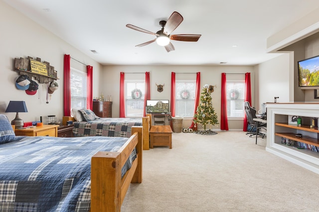 carpeted bedroom with ceiling fan