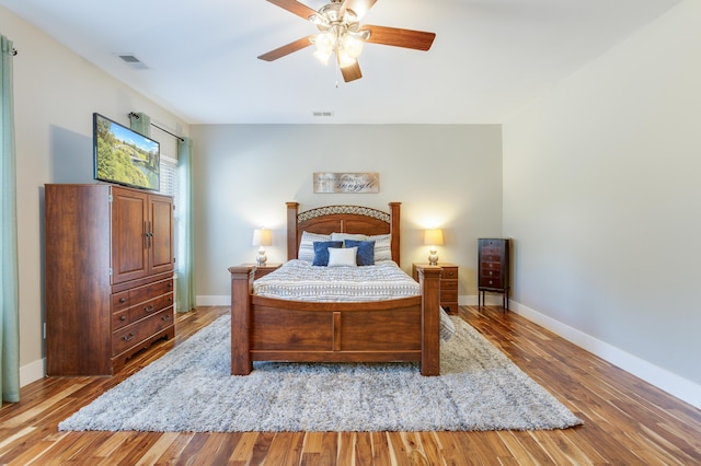 bedroom featuring ceiling fan and light hardwood / wood-style flooring